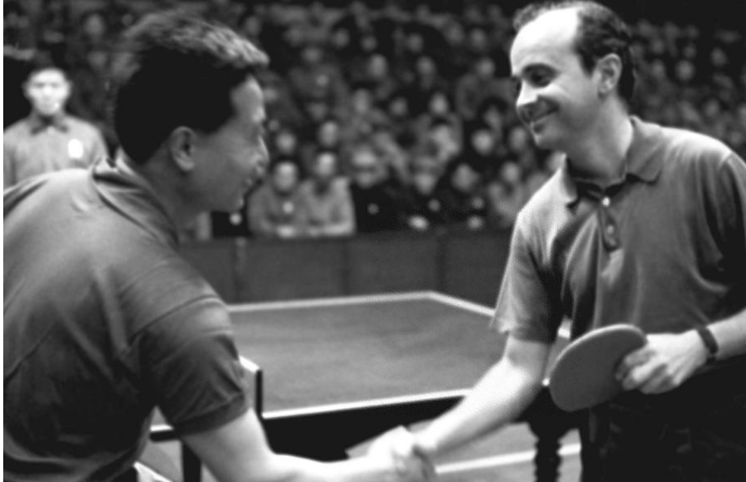 Yang Ruihua (L) shaking hands with US Dick Miles before the friendship match Yang Ruihua (L) shaking hands with US Dick Miles before the friendship match